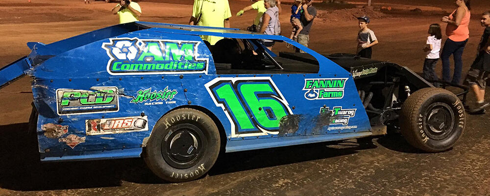 TRAVIS DICKSON TAKES THE CHECKERED