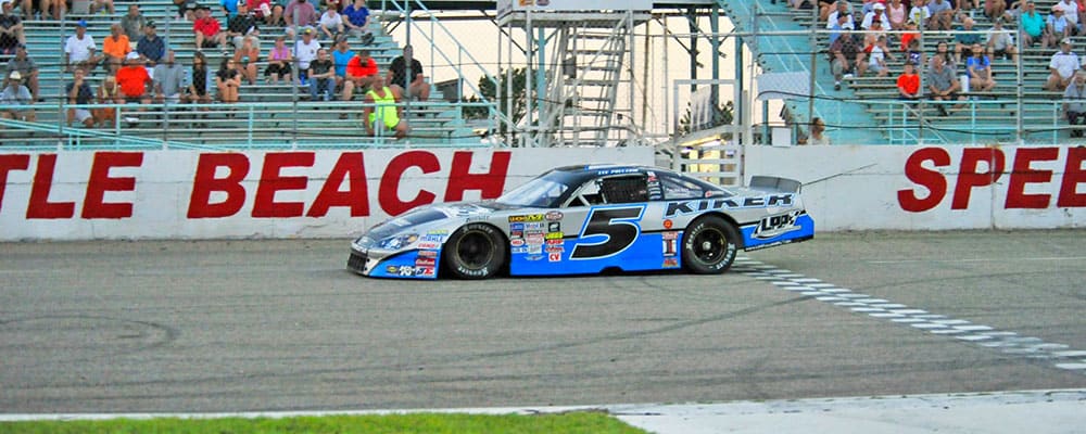 LEE PULLIAM TAKES THE CHECKERED