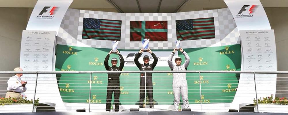 BENJAMIN PEDERSEN CELEBRATES ON THE PODIUM AT COTA