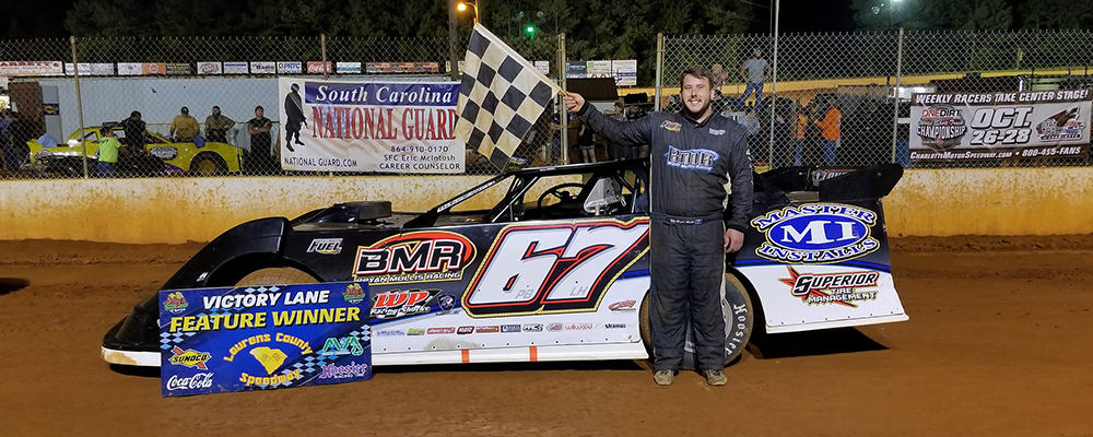 BRYAN MULLIS TAKES THE CHECKERED